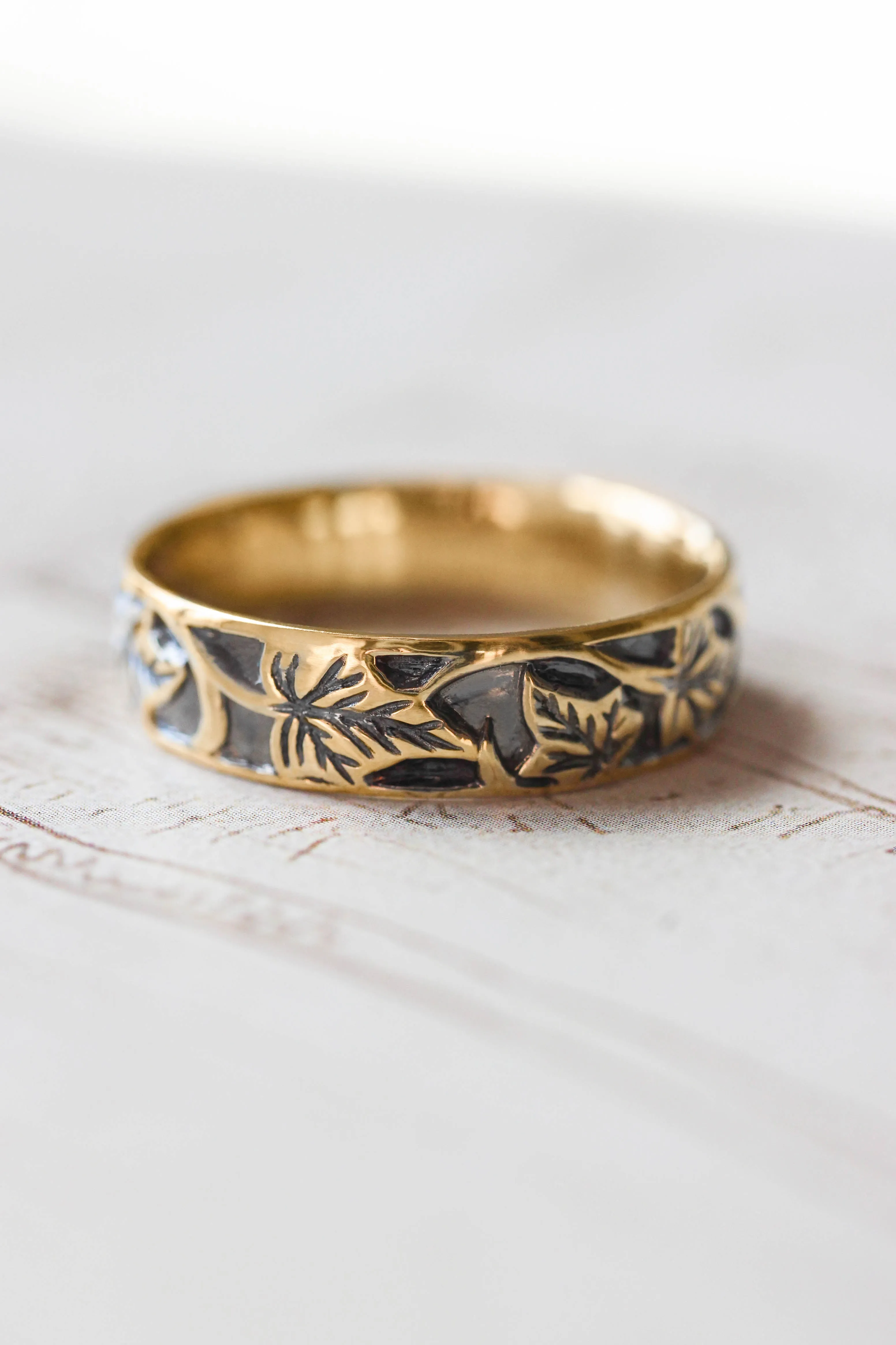 Black and gold wedding band for man, ivy leaves ring