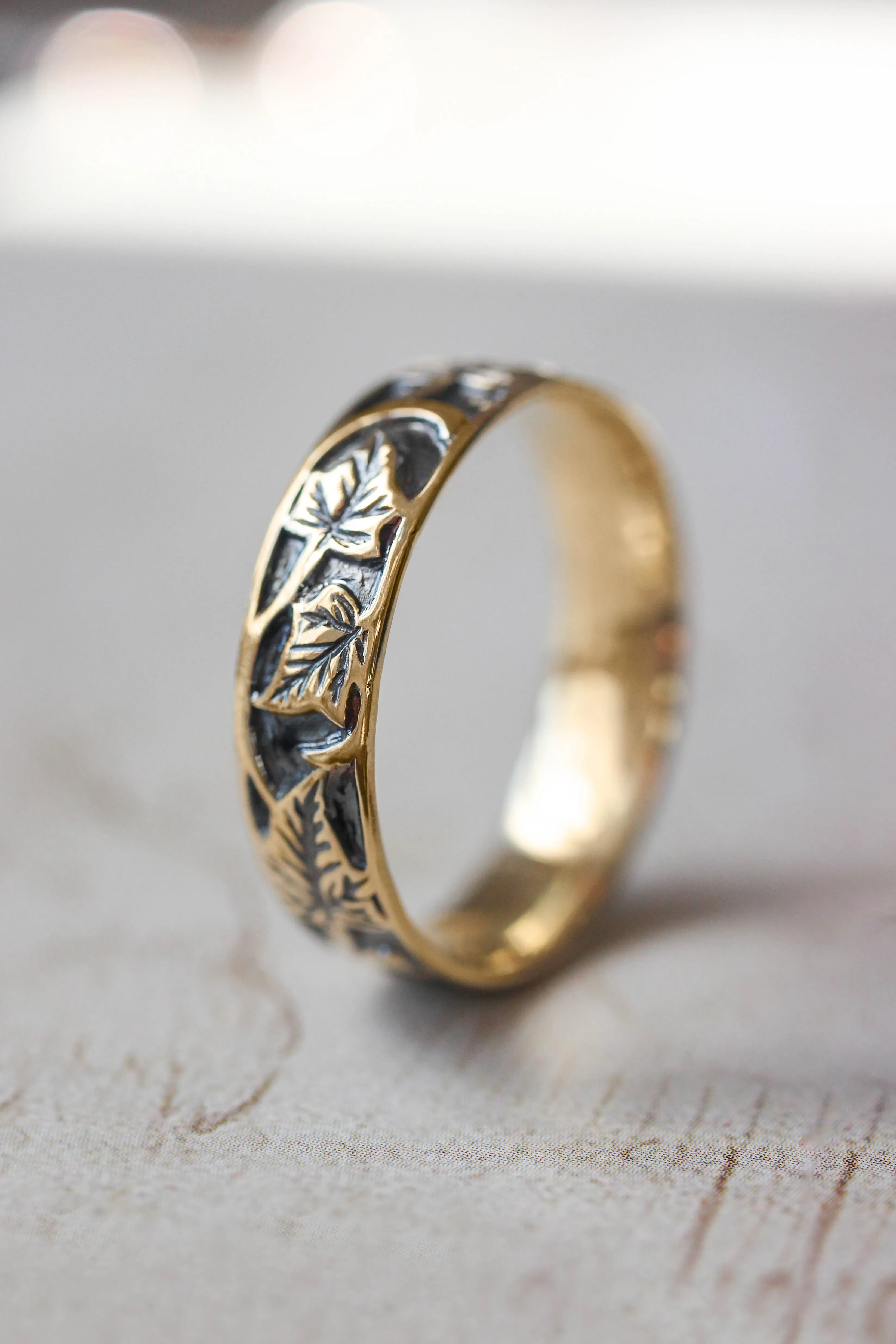 Black and gold wedding band for man, ivy leaves ring